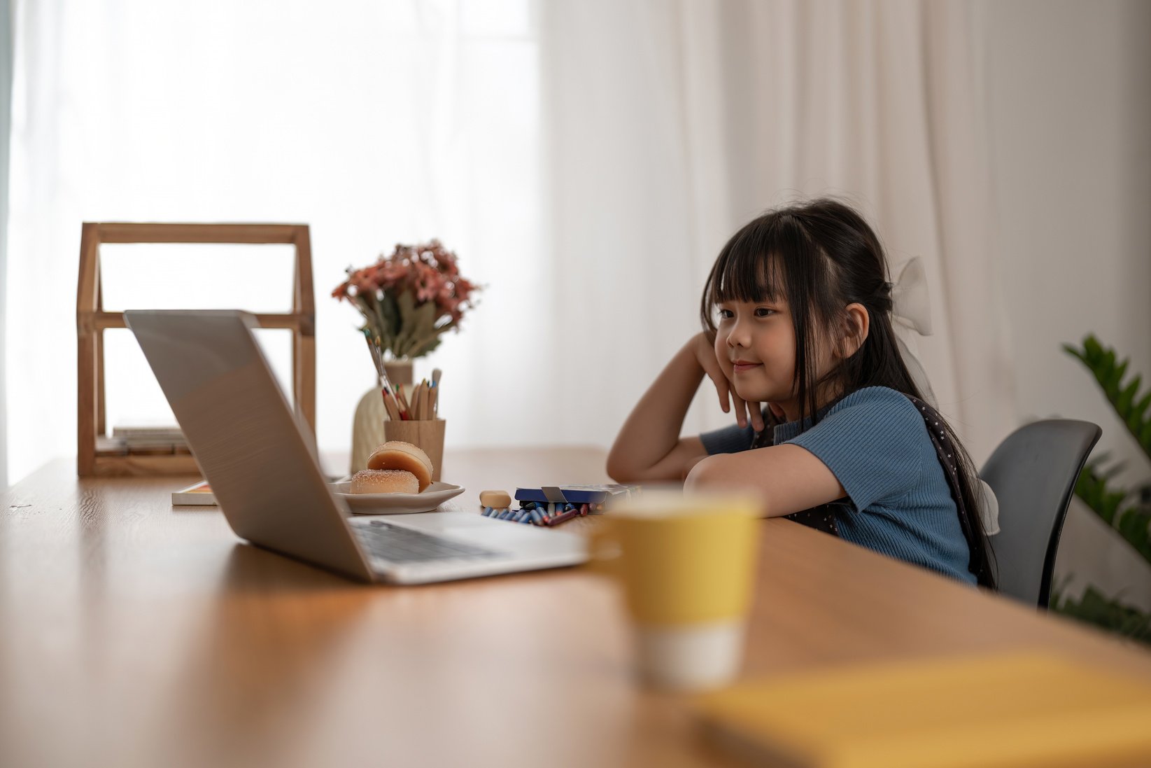 Asian Children  girl using laptop computer for online study